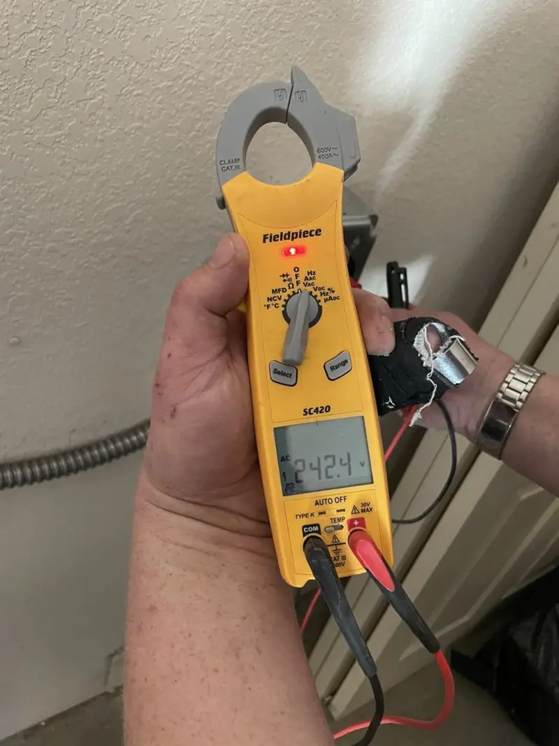 Voltage testing with clamp meter during Outlet Installation in San Bernardino